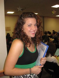 Director Katie Fornaro is all smiles as she hands out programs.